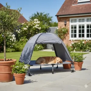 A grey outdoor cooling dog cot with a canopy providing shade on a paved British patio.