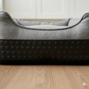 Detailed view of the anti-slip rubberised base on a dog bed to prevent sliding on wooden floors or kitchen tiles.