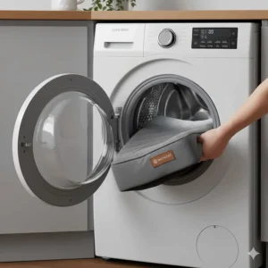 A dog bed cover being placed into a front-loading washing machine in a clean British utility room.
