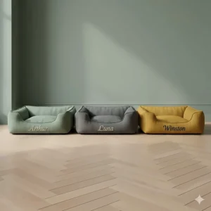 A range of personalised dog beds with names available in sage green, slate grey, and mustard yellow.