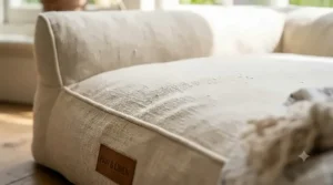 Close-up of lightweight, breathable linen fabric on a summer dog bed, showcasing the natural, airy weave for pet cooling.