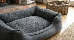 Bottom view of the coral fleece dog bed showing the durable, non-slip grip base.
