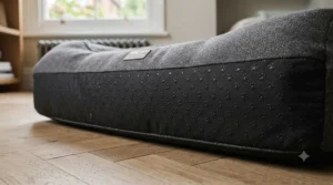 Close-up of the anti-skid rubber backing on a non-slip dog bed designed to prevent sliding on wooden floors